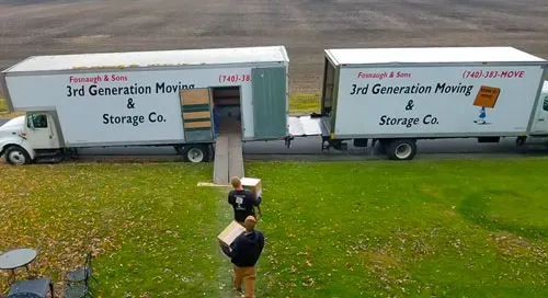 3rd Generation Moving & Storage crews loading two moving trucks